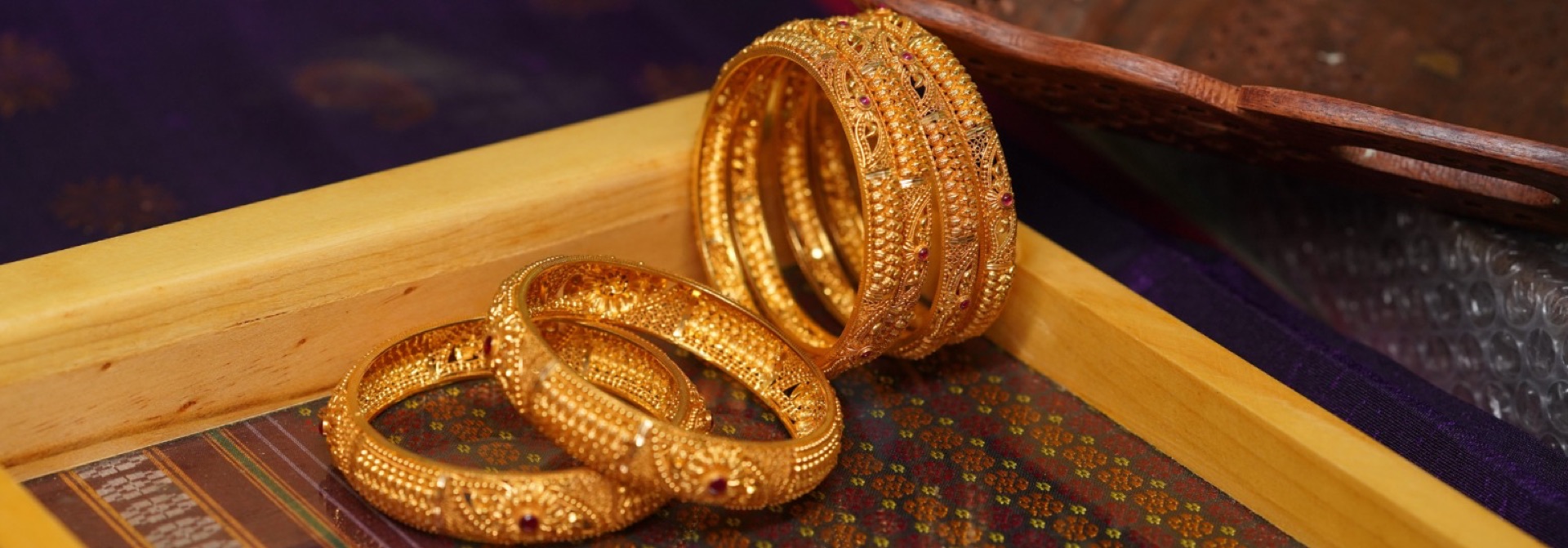 Handcrafted gold bangles by Bavane Jewellers